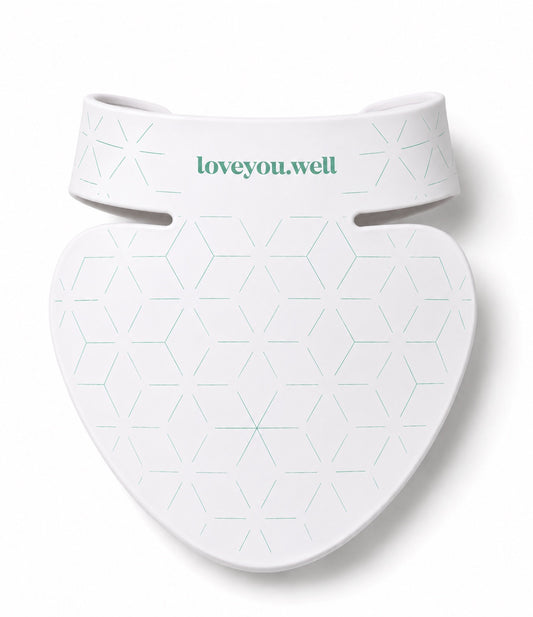 Love You Well neck and décolletage LED device in white with green branding